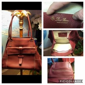 Loro piana bag Maroon pebbled leather globe bag.